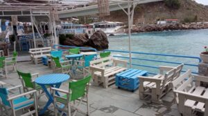Pallets as tables and chairs at a seaside cafe